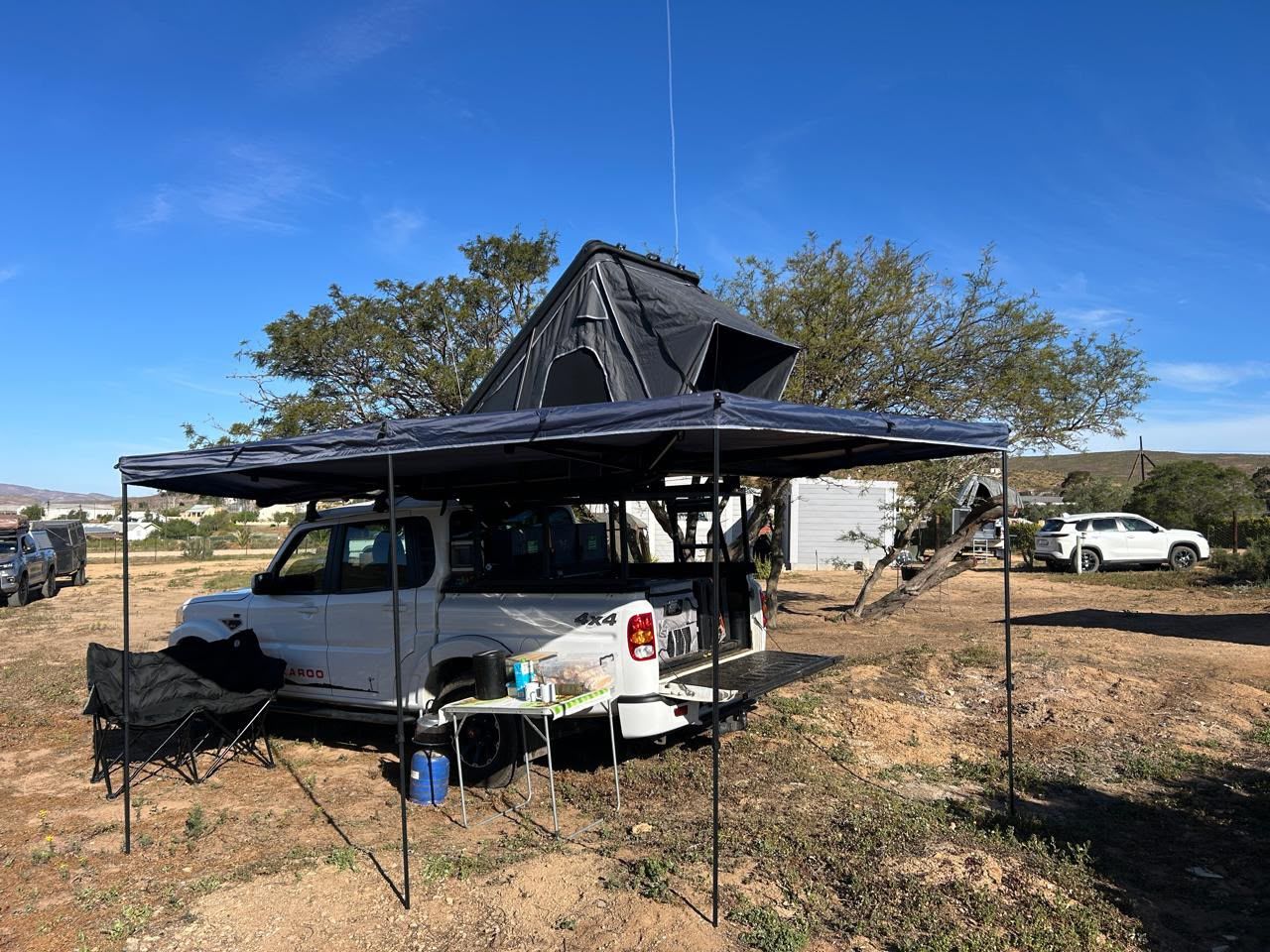 Mahindra Karoo with rooftop tent and 270° awning camped in the Karoo